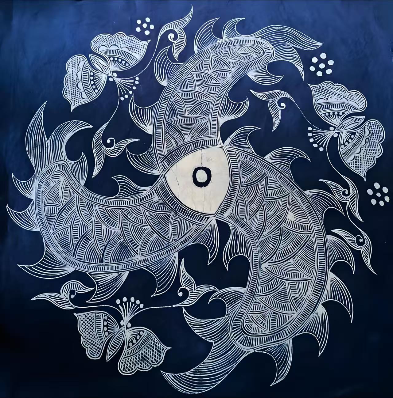 Fish and floral motifs on indigo batik